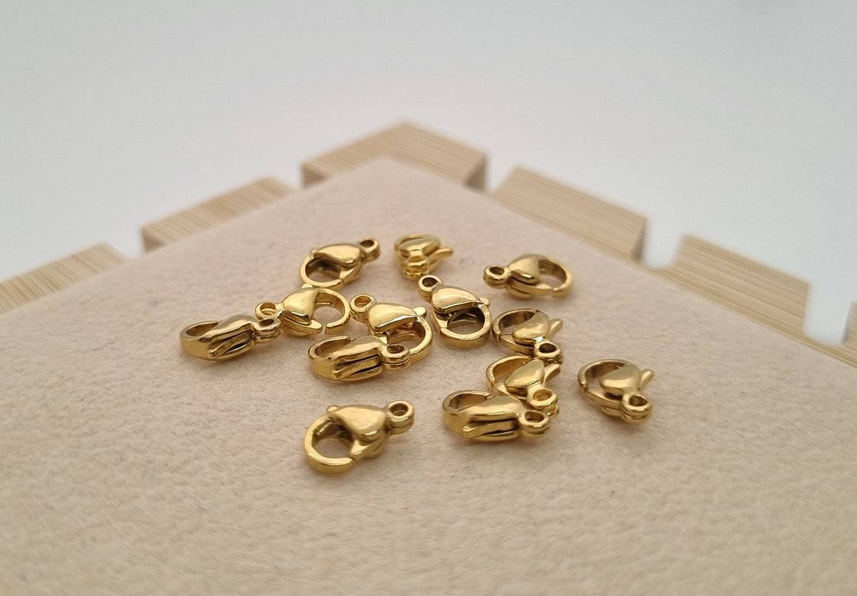 Broche Acero Dorado de 1cm - 50 Unid.